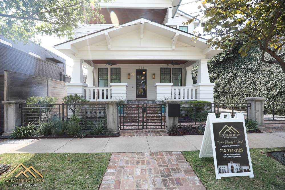 Restored craftsman-style home exterior with a covered porch and custom brickwork, built by Greater Houston Custom Builders